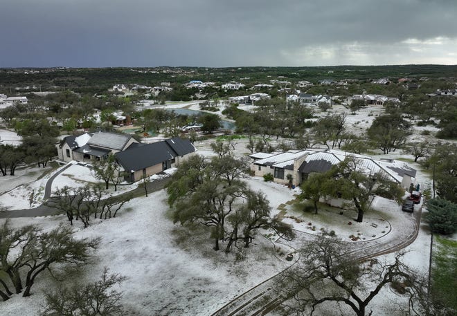 Hail covers the ground in the Belvedere neighborhood on Hamilton Pool Road near Bee Cave Wednesday March 27, 2024.