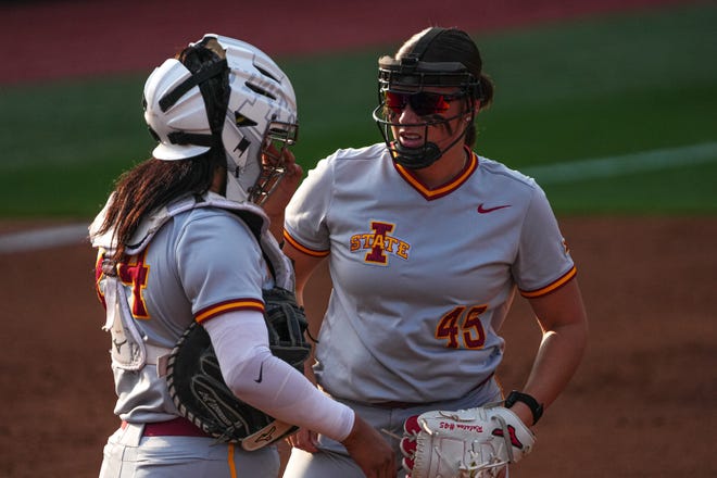 Iowa State catcher Camille Marin (24) talks to pitcher Jaiden Ralston (45) after a score by the Texas Longhorns during the game at Red and Charline McCombs Field on Friday, April 26, 2024 in Austin.