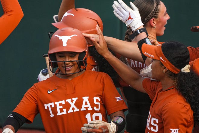 The Texas Longhorns celebrate a home run by Mia Scott (10) during the game against Iowa State at Red and Charline McCombs Field on Friday, April 26, 2024 in Austin.